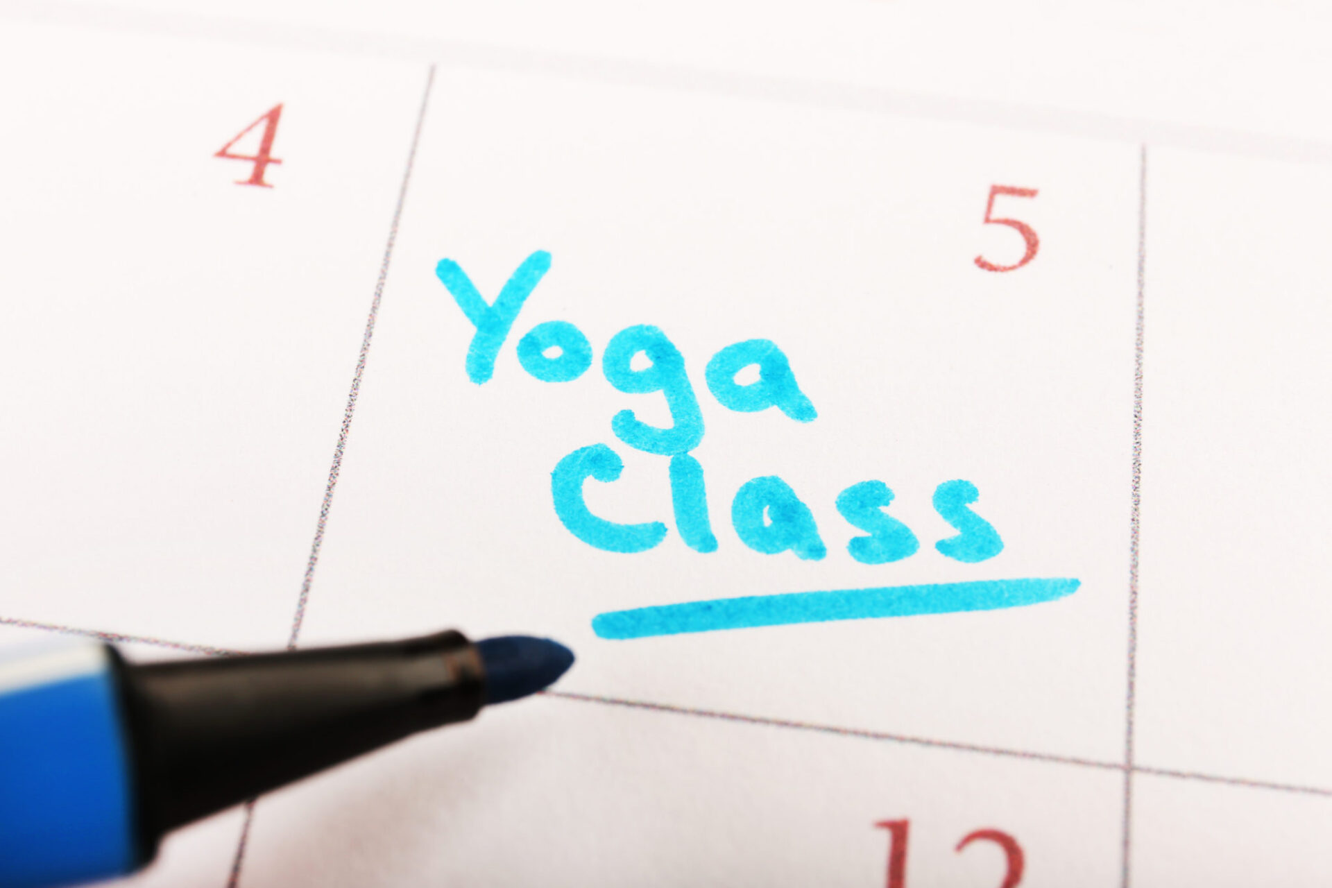Written plan Yoga Class on calendar page background Calendar